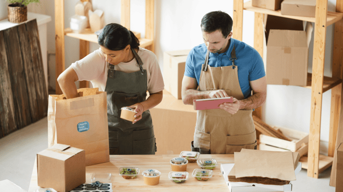 workers-packaging-orders-at-food-delivery-service